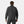 Back view of a person wearing a black Helly Hansen jacket with a high collar and ribbed cuffs