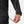 Hand adjusting the adjustable hem drawstring on a black Helly Hansen jacket
