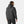 Man wearing a black Helly Hansen hooded jacket from the back