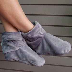 Herbal Concepts grey plush ankle booties worn on feet