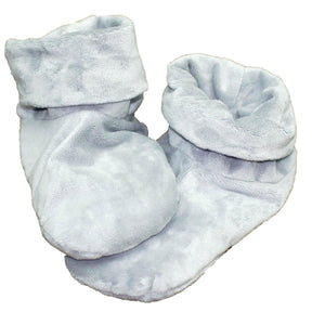 Pair of light blue plush baby booties with folded cuffs
