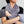 Person wearing a grey Herbal Concepts plush neck and hand warmer wrap