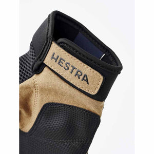 Hestra glove cuff with tan suede patch and black mesh fabric