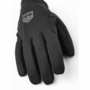 Black Hestra glove with logo on the back of the hand