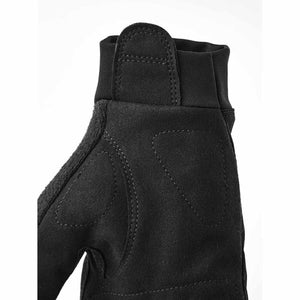 Close up of black Hestra glove cuff and palm stitching