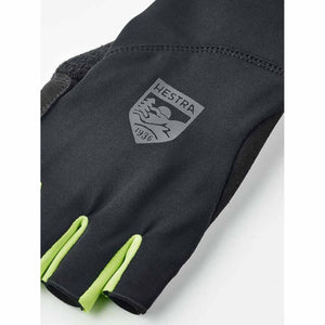 Black Hestra glove with neon yellow finger accents and brand logo