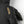 Black Hestra glove with gold embroidered logo and stitching