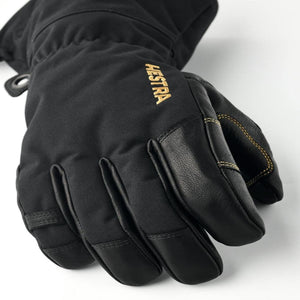 Black Hestra ski glove with leather palm and gold logo