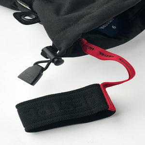 Hestra glove cuff with adjustable drawstring and red wrist strap