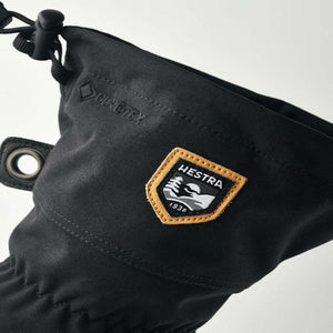 Black Hestra glove cuff with Gore-Tex branding and Hestra logo patch