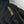 Black Hestra glove with gold embroidered logo and contrast stitching