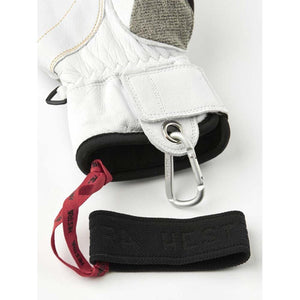 Hestra white leather ski glove cuff with carabiner and wrist strap