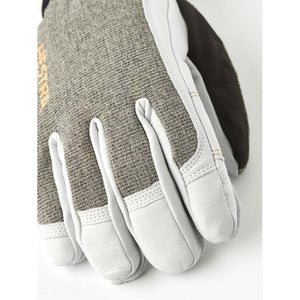 Hestra glove with grey textured fabric and white leather finger details