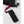 Hestra black wrist strap with red branded pull tab
