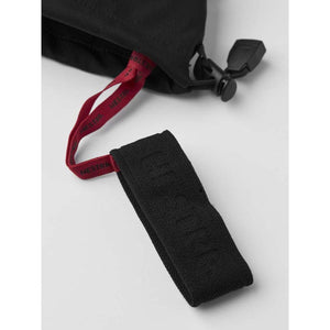 Hestra black wrist strap with red branded pull tab