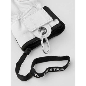 White Hestra glove cuff with attached carabiner and branded wrist strap