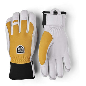 Hestra white and yellow leather ski gloves with black cuffs