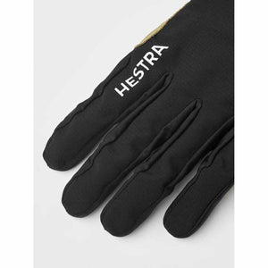 Black Hestra glove with white logo on the back of the hand