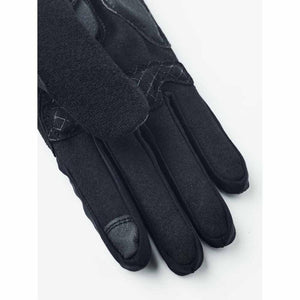 Hestra black glove showing textured fabric and leather detailing on fingers