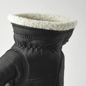 Hestra black leather glove cuff with white shearling lining