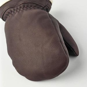 Brown Hestra leather mitten with white lining