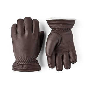Pair of brown leather gloves with white fleece lining
