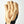 Tan work glove with orange stitching and black fabric side panel