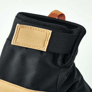Close up of Hestra glove cuff with adjustable velcro strap and pull tab