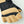 Hestra fingerless glove with black fabric and tan leather palm and knuckle reinforcement