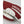 Close up of a red and white Hestra glove with white leather palm detail