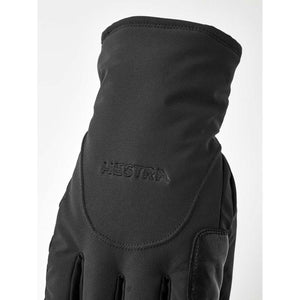 Black Hestra glove with embroidered logo on the back of the hand