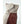 Hestra glove cuff with beige fabric and brown leather detail featuring a velcro closure