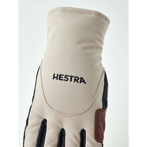 Hestra beige glove with black accents and logo