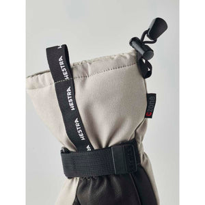 Hestra beige and black winter glove cuff with adjustable drawstring and wrist strap