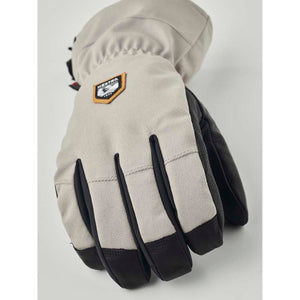 Hestra beige and black winter glove with brand logo patch