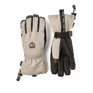 Hestra beige and black ski gloves with leather palms and adjustable wrist straps