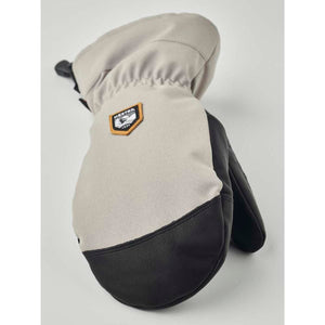 Hestra beige and black leather mitten with brand logo patch