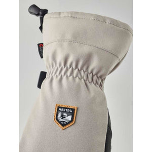 Beige Hestra mitten with elasticated wrist and brand logo patch