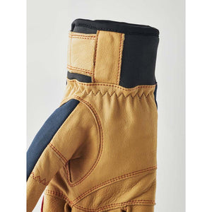 Hestra tan leather glove with black neoprene cuff and stitched detailing