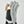Hestra white leather glove with black fabric and tan leather detail on index finger