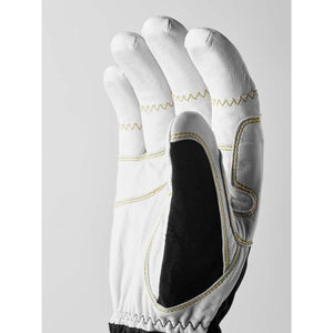 White leather work glove with black palm patch and yellow stitching