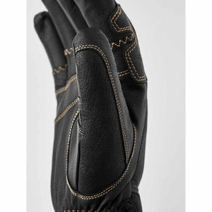 Close up of Hestra black leather glove with contrast stitching