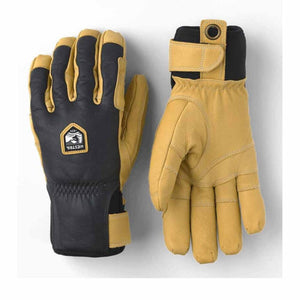 Hestra black and tan leather gloves with adjustable wrist straps