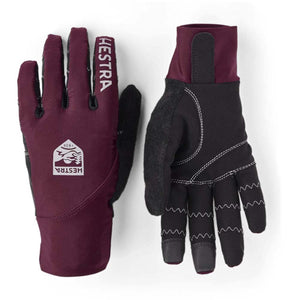 Hestra burgundy and black gloves with logo branding
