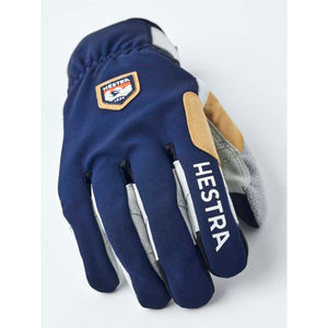 Hestra navy blue ski glove with tan leather accents and logo patch
