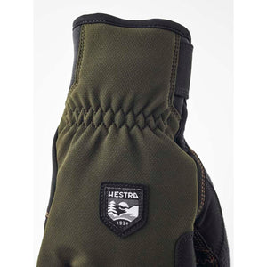 Olive green Hestra glove with elasticated wrist and brand logo patch