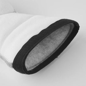 Close up of white fabric cuff with black trim