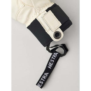 Hestra glove cuff with black wrist strap and logo pull tab