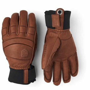 Hestra brown leather gloves with black cuffs and metal eyelet