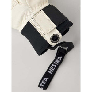 Hestra glove cuff with black wrist strap and white leather detail